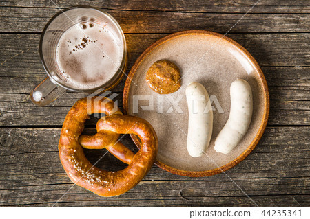 The bavarian weisswurst, pretzel and mustard. 44235341