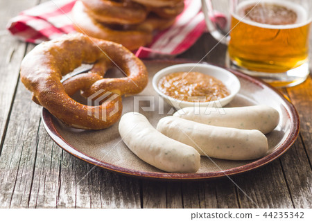 The bavarian weisswurst, pretzel and mustard. 44235342