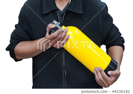 Unidentified people holding yellow oxygen tank. Unidentified people holding yellow oxygen tank. 44236192
