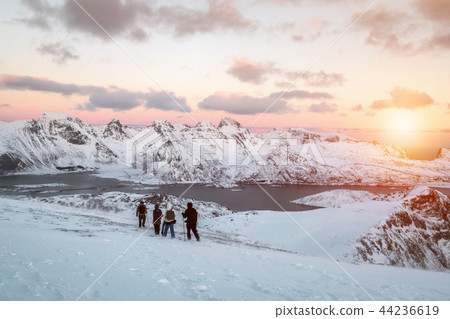 Group mountaineer climbing on snowy valley 44236619