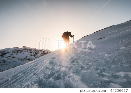 Mountaineer climbing on snowy mountain Mountaineer climbing on snowy mountain 44236637
