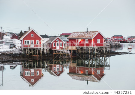 Scandinavian village with red house reflection Scandinavian village with red house reflection 44237281