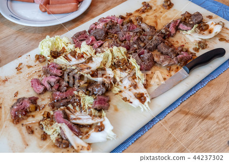 Beef slices on cabbage with berry, cola sticky Beef slices on cabbage with berry, cola sticky 44237302