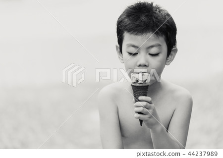 asian boy children eating ice cream candid asian boy children eating ice cream candid 44237989