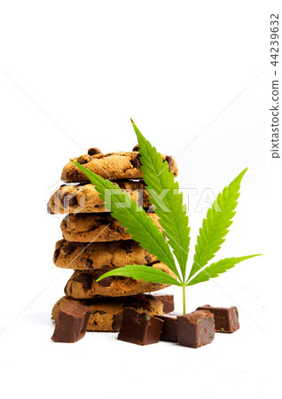 Chocolate chip cookies with marijuana isolated Chocolate chip cookies with marijuana isolated 44239632