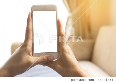 Hands working on a smart phone. Hands working on a smart phone. 44241233