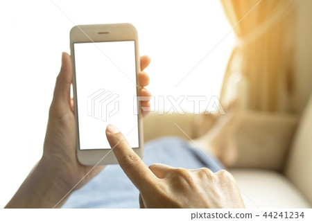 Hands working on a smart phone. Hands working on a smart phone. 44241234