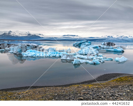 blue icebergs floating in jokulsarlon, ultra long exposure 44241632