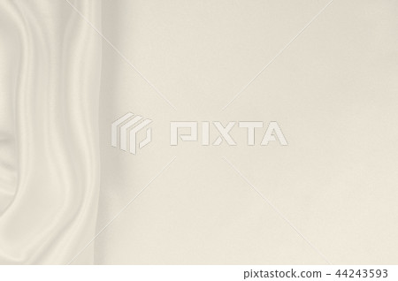 Smooth elegant golden silk or satin luxury cloth Smooth elegant golden silk or satin luxury cloth 44243593