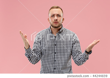 Beautiful male half-length portrait isolated on pink studio backgroud. 44244839
