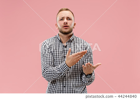 Beautiful male half-length portrait isolated on pink studio backgroud. 44244840