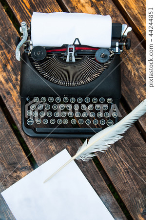 Antique vintage typewriter in on a wooden table Antique vintage typewriter in on a wooden table 44244851