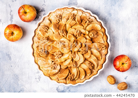 Apple pie with walnuts and cinnamon. Apple pie with walnuts and cinnamon. 44245470