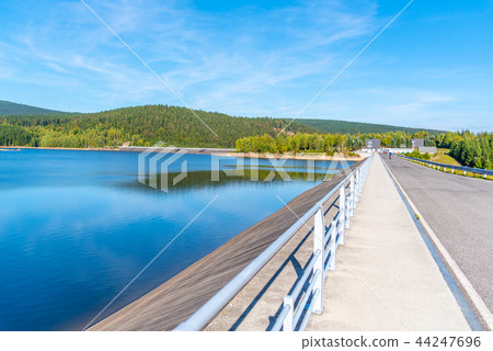 Josefuv Dul Dam, Earth-filled dam in Jizera Mountains with asphalt road on the top, Czech Republic Josefuv Dul Dam, Earth-filled dam in Jizera Mountains with asphalt road on the top, Czech Republic 44247696