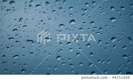 Dropes of water on car window Dropes of water on car window 44252048