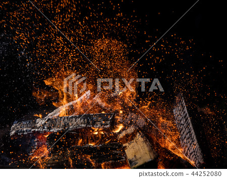 Burning wooden logs in fire, campfire on black Burning wooden logs in fire, campfire on black 44252080