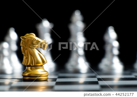 Gold knight chess piece face with silver team Gold knight chess piece face with silver team 44252177