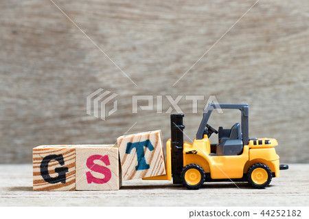 Toy forklift hold letter block T to word GST Toy forklift hold letter block T to word GST 44252182