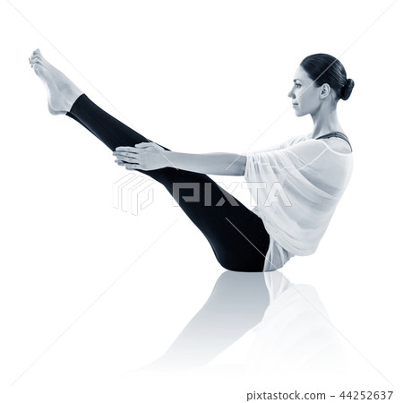 Young woman doing yoga exercise on the floor. 44252637