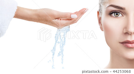 Woman face and pouring water in hand. Woman face and pouring water in hand. 44253068
