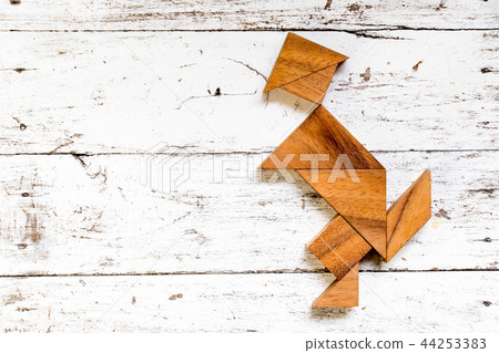Tangram puzzle in happy running man shape Tangram puzzle in happy running man shape 44253383