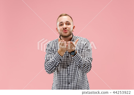 Portrait of attractive man with kiss isolated over pink background 44253922