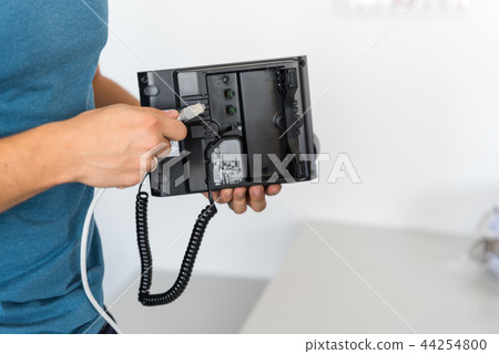 VoIP Telephony. Specialist connects the phone VoIP Telephony. Specialist connects the phone 44254800