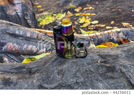 electronic cigarette is standing on the root  44256011