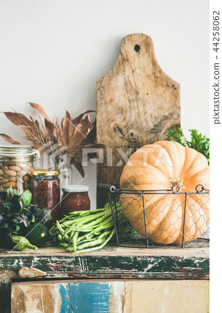 Autumn food ingredients and utensils over cupboard chest 44258062