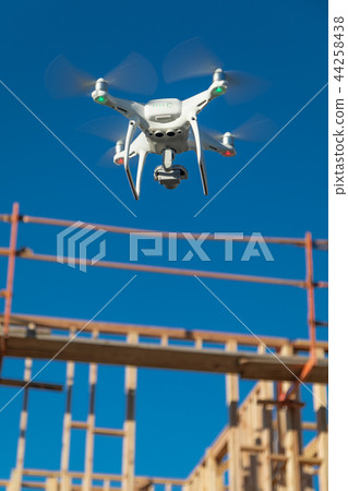 Drone Flying and Inspecting a Construction Site 44258438