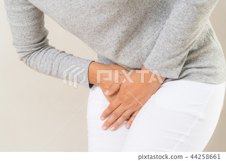 Young woman having painful stomachache 44258661