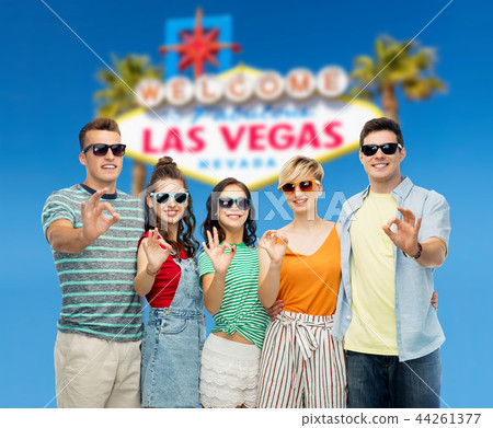 friends in sunglasses showing ok hand sign 44261377