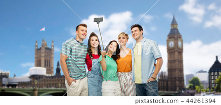 friends taking selfie over london background 44261394