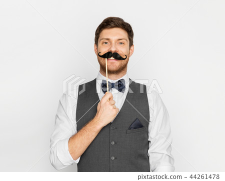 happy young man with fake moustache happy young man with fake moustache 44261478