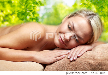 young woman lying on massage table in spa young woman lying on massage table in spa 44261804