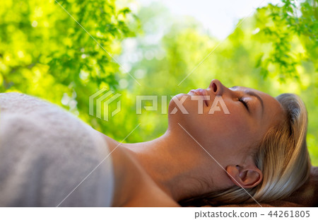 young woman lying on massage table in spa young woman lying on massage table in spa 44261805