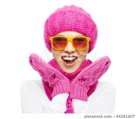 happy teenage girl in winter hat and sunglasses happy teenage girl in winter hat and sunglasses 44261807