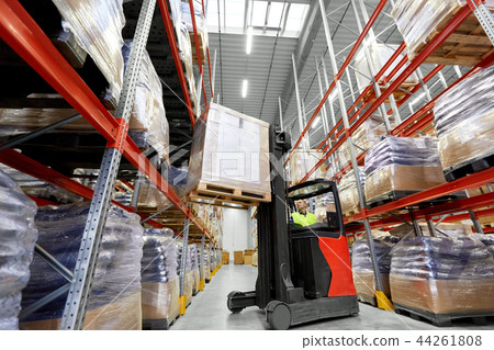 loader operating forklift at warehouse 44261808
