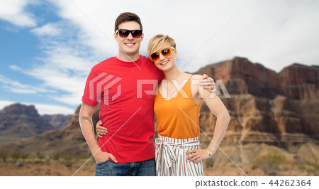couple in sunglasses hugging 44262364