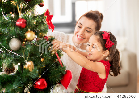 Happy Family Decorating Christmas Tree At Home Stock Photo 44262506 Pixta - A Family By Decorating Christmas Tree At Home Happy Family Decorating Christmas Tree At Home Stock Photo 44262506 Pixta - A Family By Decorating Christmas Tree At Home