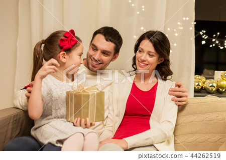 happy family with christmas present at home 44262519