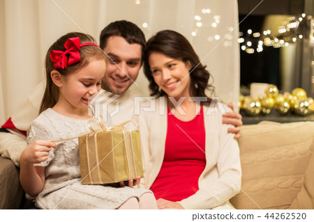 happy family with christmas present at home 44262520