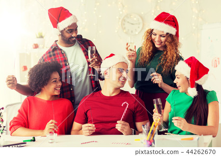 happy team celebrating christmas at office party 44262670