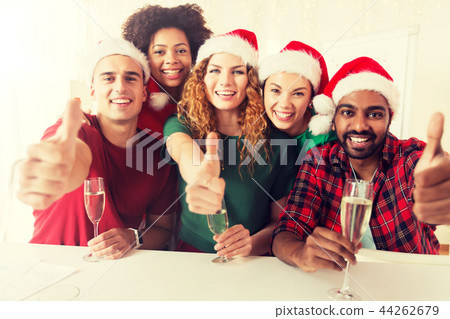 happy team celebrating christmas at office party 44262679