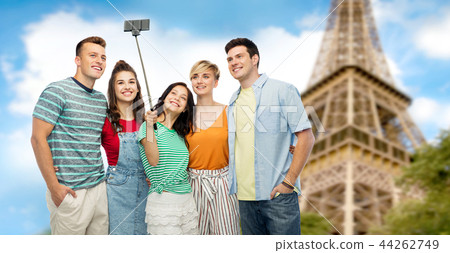 friends taking selfie by monopod over eiffel tower friends taking selfie by monopod over eiffel tower 44262749