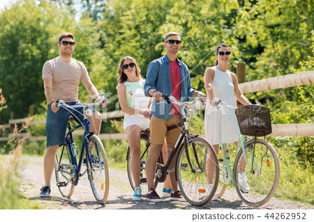 happy friends riding fixed gear bicycles in summer 44262952