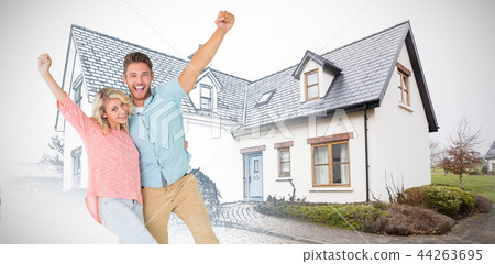 Composite image of attractive couple smiling and cheering 44263695