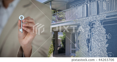 Composite image of mid section of business executive showing house key 44263706