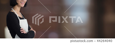 Composite image of smiling waitress standing with arms crossed against white background 44264040