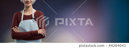 Composite image of smiling female chef standing with arms crossed 44264041